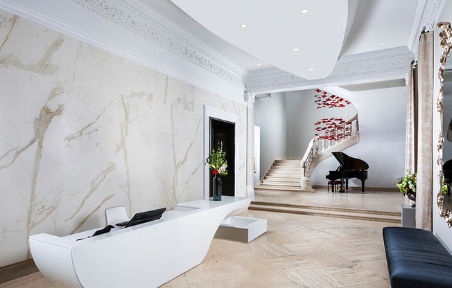 Exquisit finishes like travertine flooring, marble wall features, and artful accents throughout the building will welcome you home at Modera Sedici
