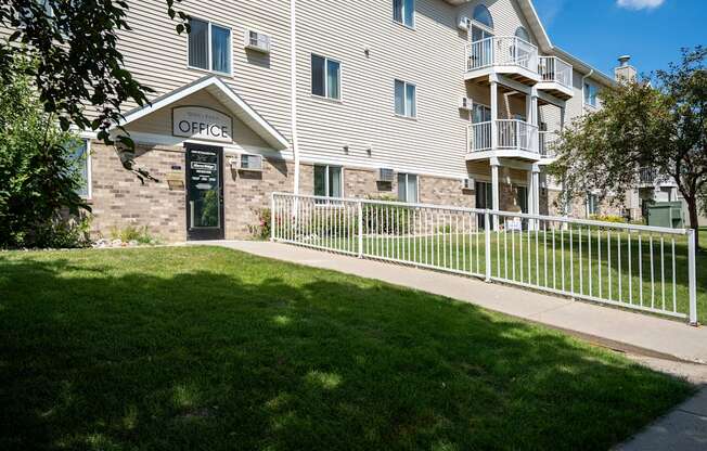 apartment with an office sign above the door. Bismarck, ND Sierra Ridge Apartments