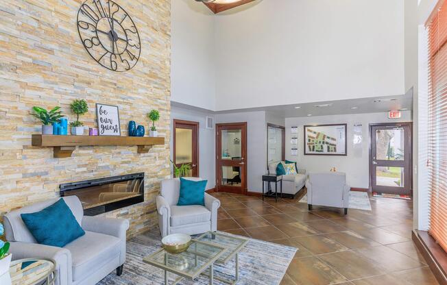 a living room filled with furniture and a fireplace