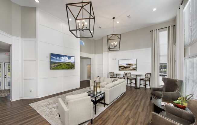a living room with couches and chairs