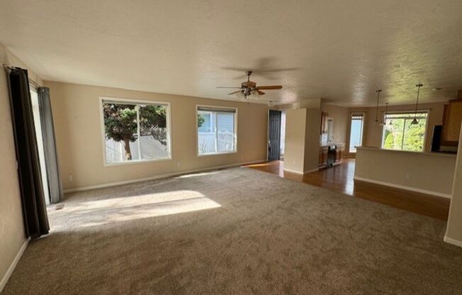 Available Now: One level 2 Bedroom Home with a Den and landscaping provided