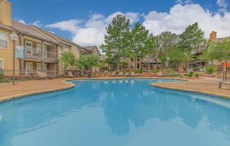 a house with a large pool of water