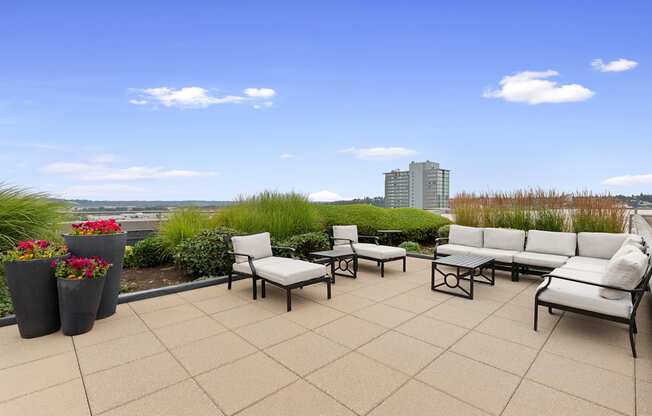 Cozy Seating Area on Rooftop Resident Lounge a view of the city at Villaggio Apartment Homes, Tacoma