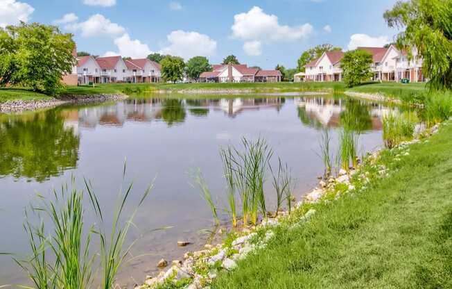 Large, beautiful lake with lush natural surrounding at Waterstone Place Apartments in Indianapolis, IN