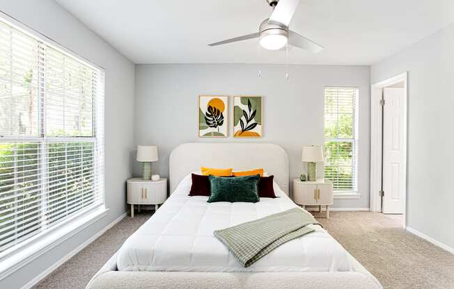 a bedroom with a large white bed and a ceiling fan at Parc at 1875, College Park, GA
