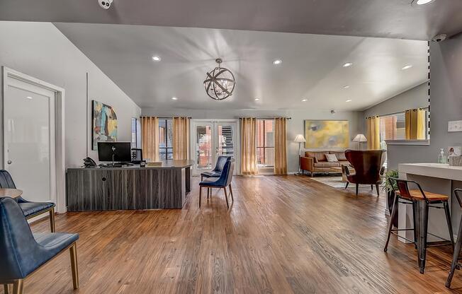 a living room filled with furniture and a large window