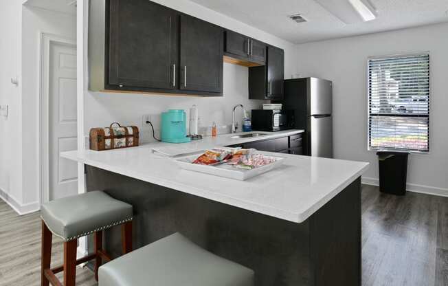 the preserve at ballantyne commons apartment kitchen with island and stools