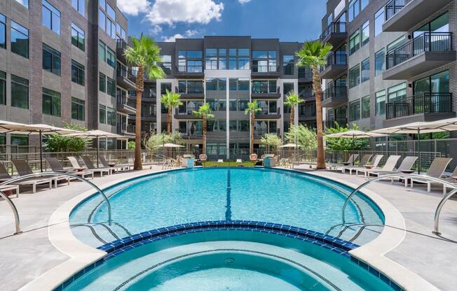 Cool off in the resort-style pool or take a relaxing soak in the spa, all surrounded by lush landscaping and stylish loungers.