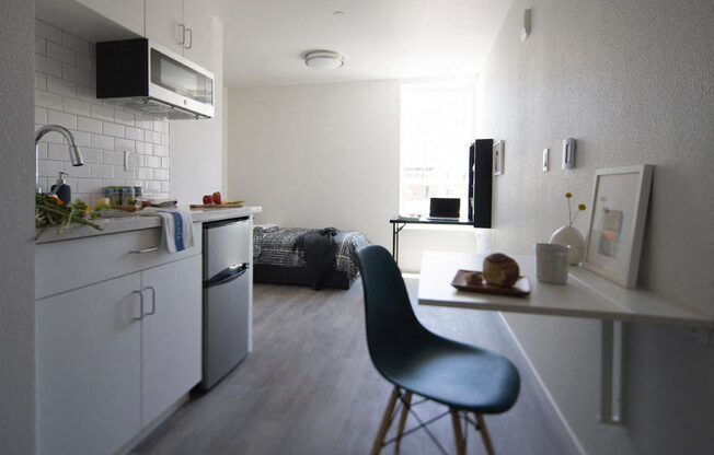 a kitchen and a living room in a room