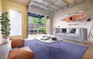 Staged Living room with open garage door