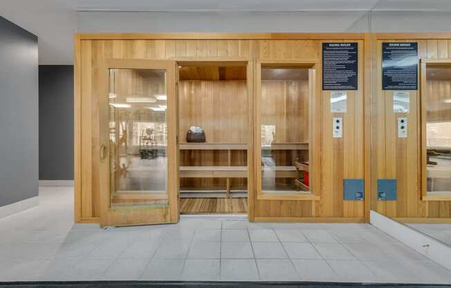 the entrance to a building with wood and glass doors