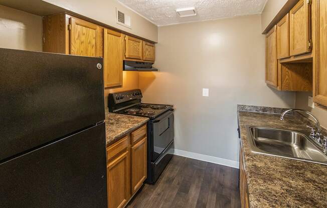 This is a photo of the kitchen of an upgraded 950 square foot, 2 bedroom apartment at Deer Hill Apartments in Cincinnati, OH.