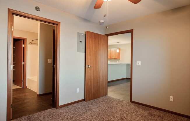 a bedroom and the bathroom. Fargo, ND Urban Plains Apartments