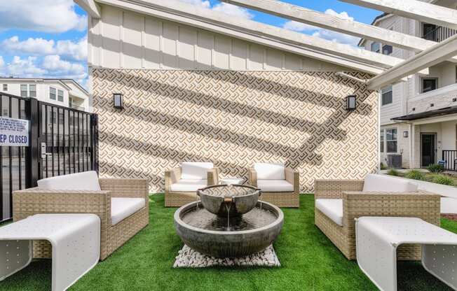 Sitting area with fountain in the center of the seating and Grass at Morgan Ranch Apartments, Morgan Hill, CA, 95037