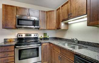 Kitchen | Cedars Lakeside Apartments in Little Canada, MN