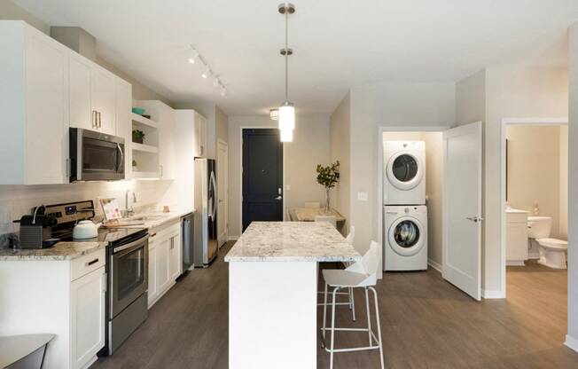 Kitchen and Laundry Space at The McMillan Apartments in Shoreview, MN 55126