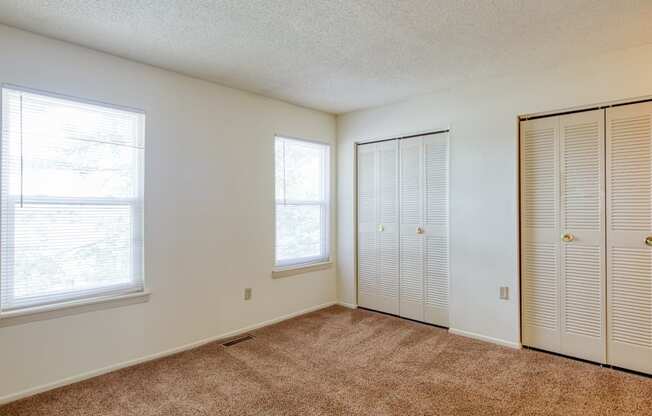 Bedroom with closed closets at The Everett Apartments in Roanoke, VA 24018