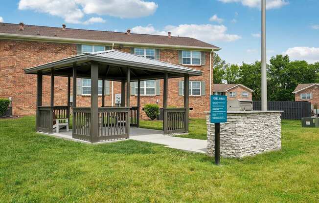 A covered walkway leads to a brick building.
