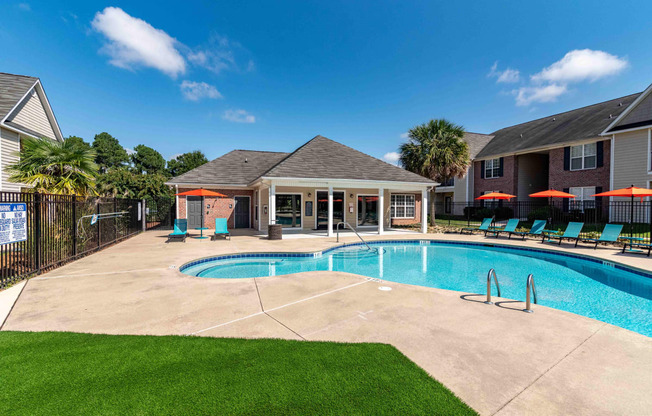 our apartments have a large pool and a house with chairs