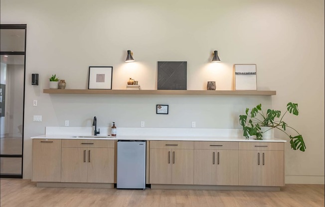 A kitchen with a white countertop and wooden cabinets at Northplace Apartment Homes, Oregon