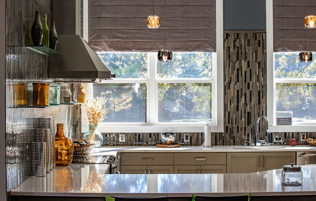 a kitchen with a large window and a counter top