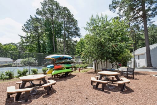 our apartments have a community picnic area with tables and chairs  at Lake Johnson Mews, Raleigh, North Carolina