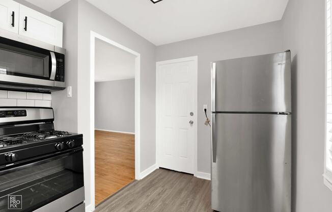 a kitchen and living room in a 555 waverly unit