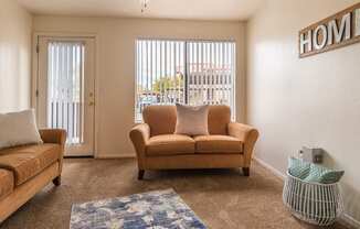 Cantera living rooms with private balconies and sliding glass door