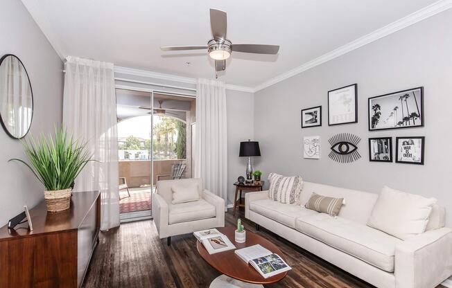 a living room filled with furniture and a flat screen tv