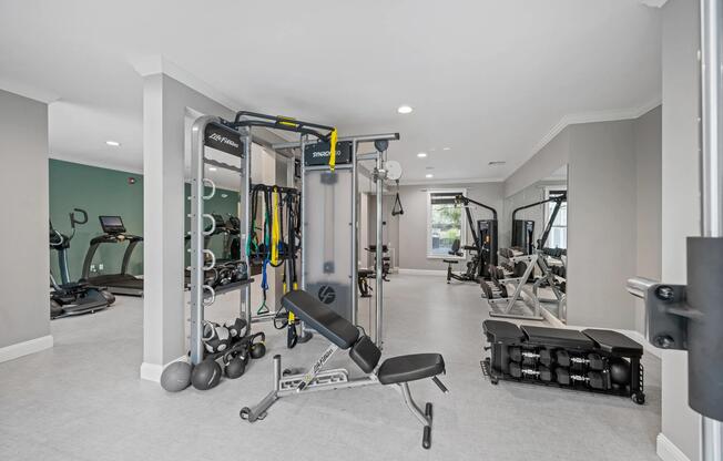 Functional training zone with cable equipment, free weights, and dedicated workout stations designed to support strength building, mobility, and cross-training routines.