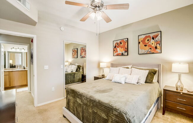 a bedroom with a large bed and a ceiling fan at Adiamo Palm Valley, Arizona