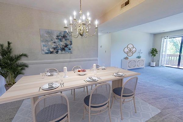 a dining room with a table and chairs and a chandelier