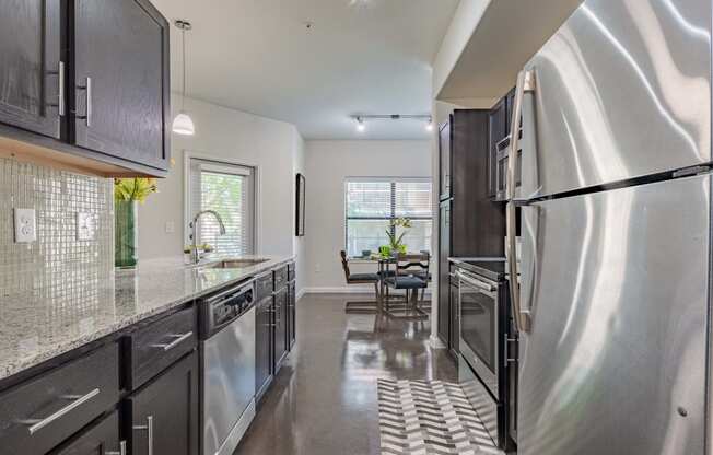 Dining Room With Kitchen View at Legacy Brooks, San Antonio, 78223