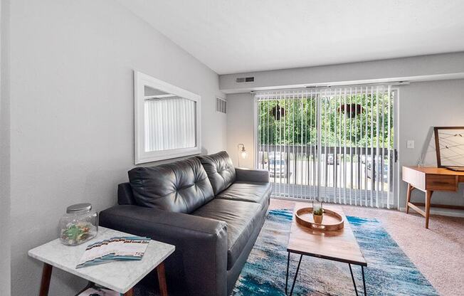 living room with patio/balcony connected