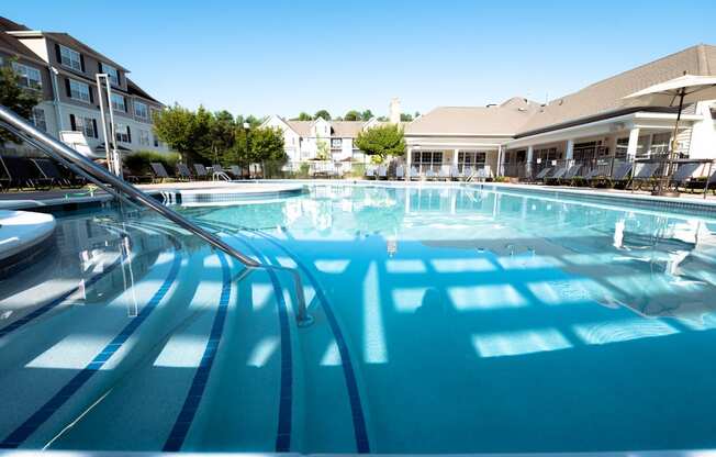 View of Pool and Clubhouse Exterior. The Cascades at Tinton Falls, Tinton Falls NJ 07753