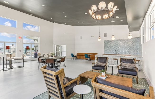 A large room with a lot of chairs and tables.