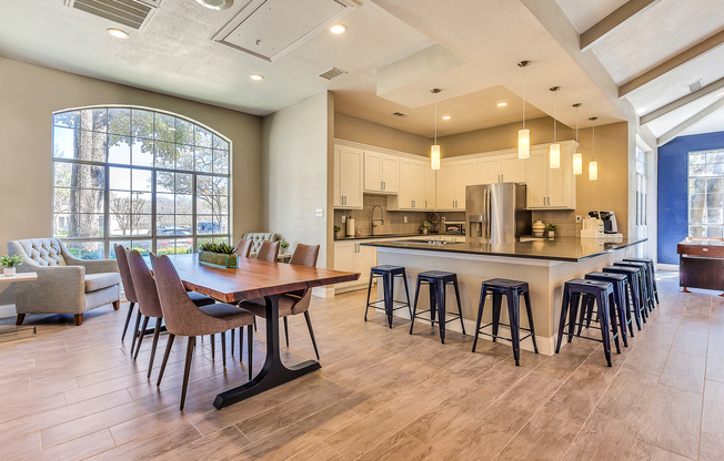 Modern resident lounge with entertainment kitchen, games and lounge seating