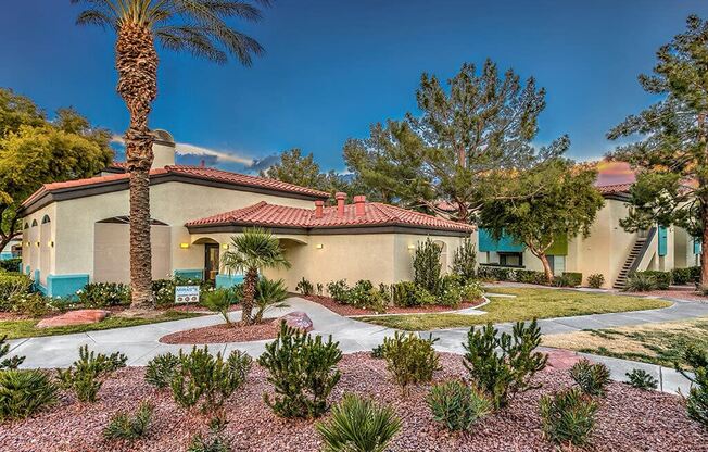 a house with a courtyard with plants and trees at Mirasol Apartments, Las Vegas, 89119