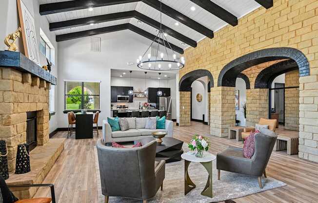 A modern living room with a fireplace and a grey sofa.