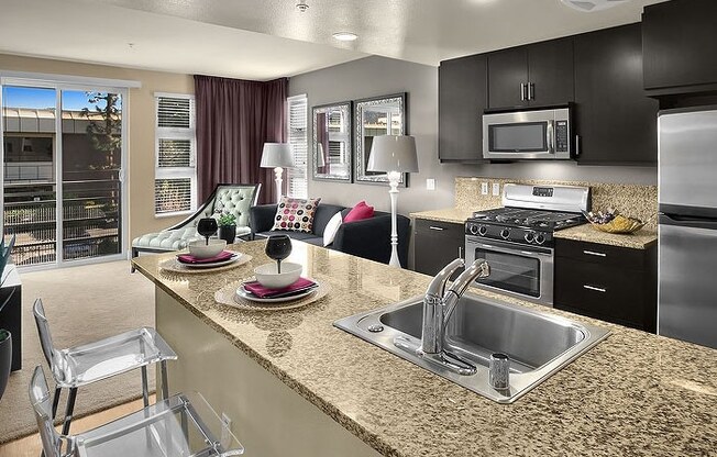 a kitchen with a large counter top next to a stove top oven