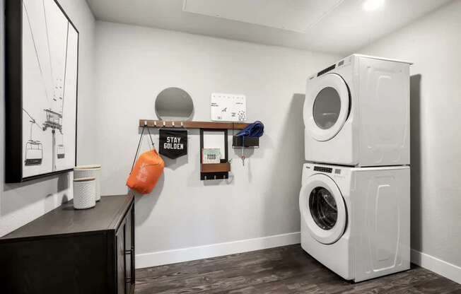 A washing machine is stacked on top of another in a laundry room.