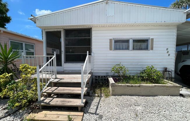 55+ Fair Lane Acres Community. 2 Bed, 2 Bath Mobile Home with 1-Car Carport. Close to Beaches & Nearby Attractions!