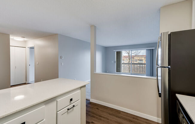 Kitchen Overlooking the Living Room with Grey Walls