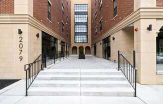 the entrance to a building with stairs in front of it