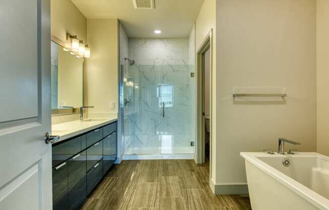 bathroom with tub and walk-in shower