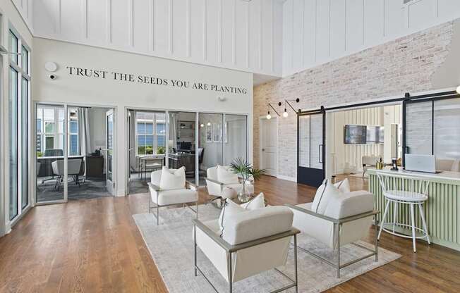 A living room with a sign that says "Trust the seeds you are planting".