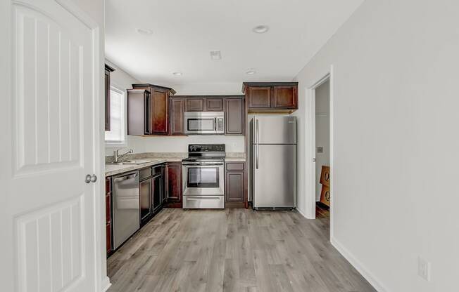 Kitchen with wooden floors and stainless steel appliances