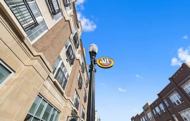 a sign on a pole in front of a building