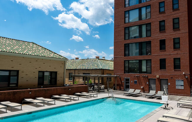 a swimming pool at a hotel in front of a building