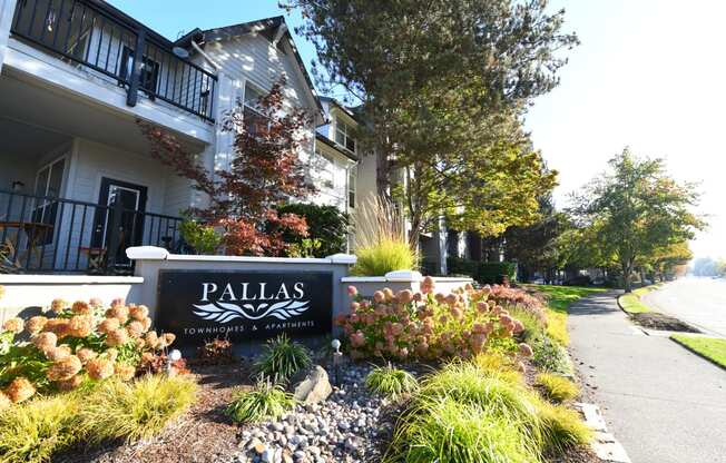 the sign in front of the Pallas Apartments and Townhomes